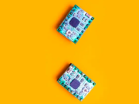 three microcircuit over orange background