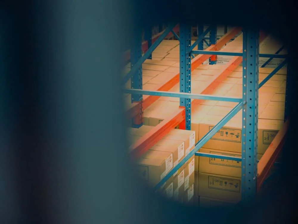supply chain cardboard boxes on grey shelf